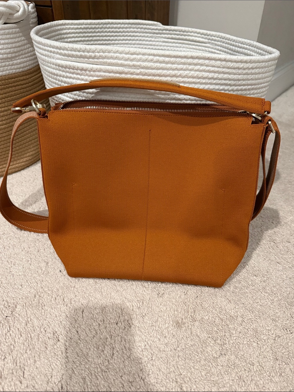 Rothy's mini bucket bag in tan/Burnt Orange